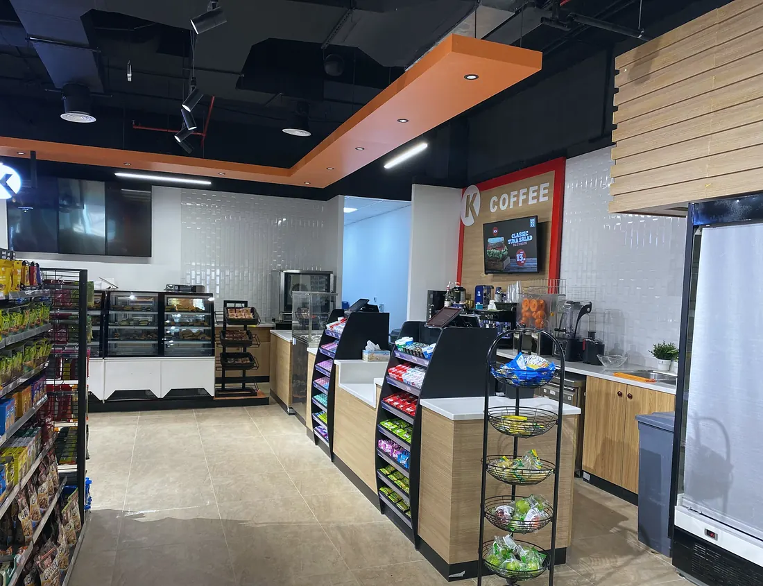 Circle K minimart, Al Ain: coffee counter with orange fascia and timber panelling (frame 2 of 3)