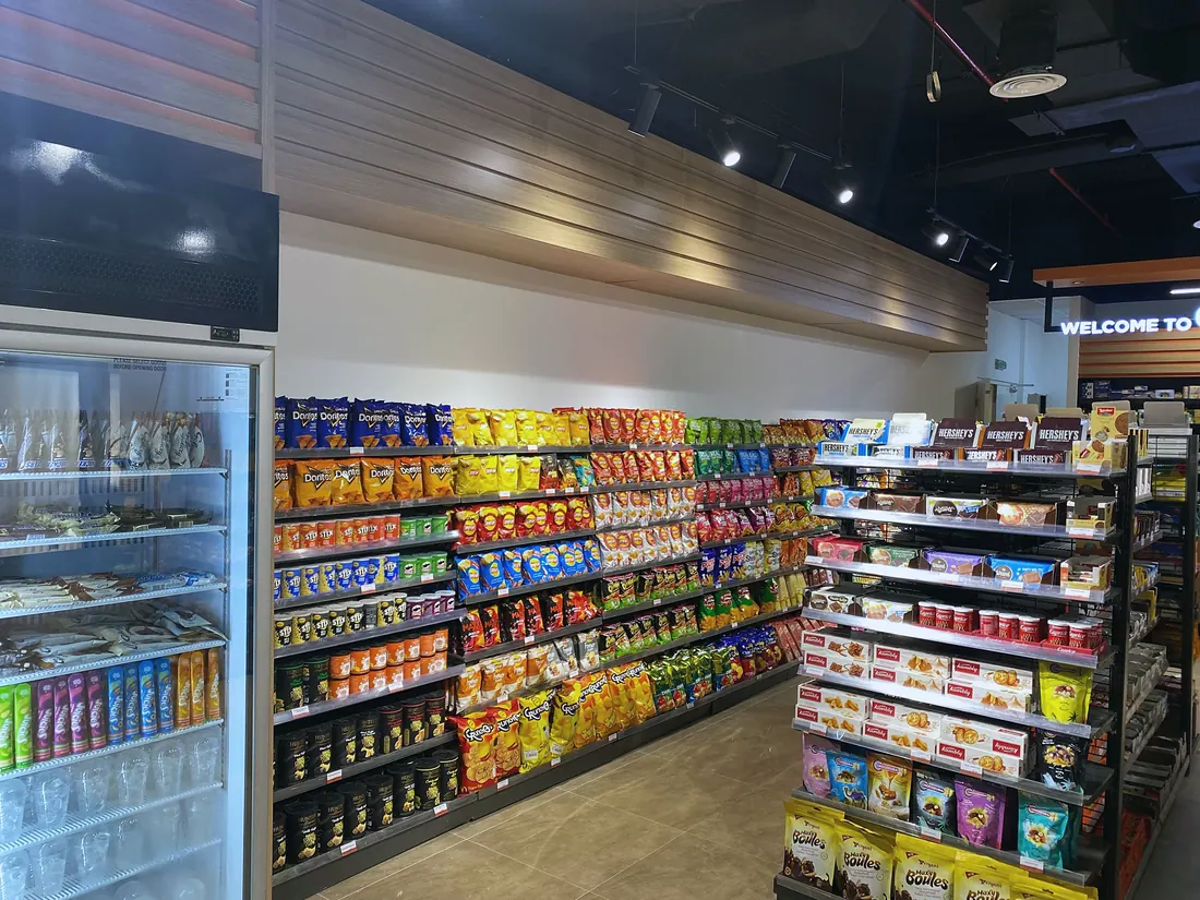 Circle K minimart, Al Ain: chiller cabinets and snack aisle (frame 3 of 3)