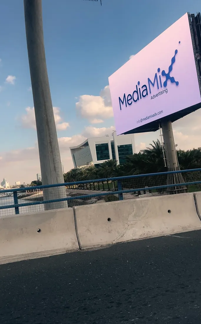 MediaMix LED wall on its mast beside the road (frame 2 of 3)
