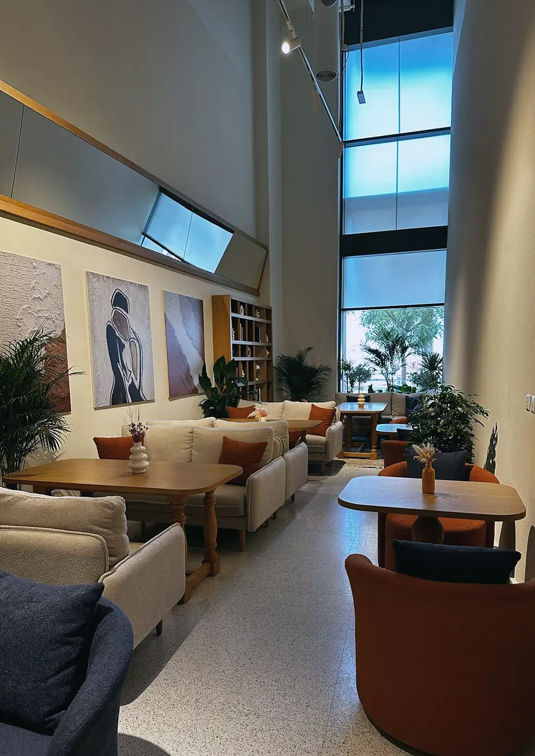 Saya Brasserie: window seating with terrazzo floor and framed art (frame 2 of 3)